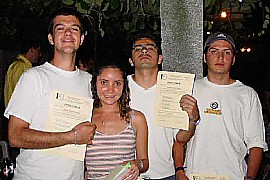 Friends showing off their diplomas